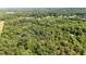 Lush green forest view with glimpses of houses among the trees at 6896 Heardsville Rd, Cumming, GA 30028