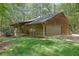 Cabin-style home with a two-car garage and covered porch at 6896 Heardsville Rd, Cumming, GA 30028