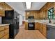 Functional kitchen with ample cabinet space and black appliances at 6896 Heardsville Rd, Cumming, GA 30028