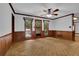 Living room with access to backyard featuring classic wood paneling at 6896 Heardsville Rd, Cumming, GA 30028