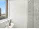 Bright bathroom featuring white subway tile in the shower and a view of the city at 75 Ponce De Leon Ne Ave # 1004, Atlanta, GA 30308