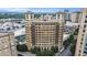 Exterior view of building with architectural details and treetop views at 75 Ponce De Leon Ne Ave # 1004, Atlanta, GA 30308