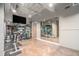 Well-equipped gym with mirrors, weight racks, and a TV, offering a convenient fitness space at 75 Ponce De Leon Ne Ave # 1004, Atlanta, GA 30308