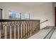 Hallway with decorative iron railing and city views from windows at 75 Ponce De Leon Ne Ave # 1004, Atlanta, GA 30308