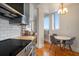 Modern kitchen featuring sleek countertops, stainless steel appliances, and a dining area with great light at 75 Ponce De Leon Ne Ave # 1004, Atlanta, GA 30308