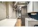 Functional laundry room with modern washer and dryer units, utility sink, and ample storage space at 75 Ponce De Leon Ne Ave # 1004, Atlanta, GA 30308