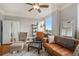 Inviting living room with hardwood floors, ceiling fan, and a comfortable leather sofa at 75 Ponce De Leon Ne Ave # 1004, Atlanta, GA 30308