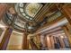 Elegant lobby with stained glass ceiling, ornate columns, and a grand staircase at 75 Ponce De Leon Ne Ave # 1004, Atlanta, GA 30308