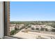 Scenic cityscape view from the residence showcasing nearby buildings and lush green trees at 75 Ponce De Leon Ne Ave # 1004, Atlanta, GA 30308