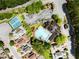 Aerial view showcasing the community pool, tennis courts, and surrounding residential area at 114 Batten Board Way, Woodstock, GA 30189