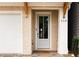 Close-up of the front door, showcasing the stone facade, wooden accents, and a 'welcome home' door mat at 114 Batten Board Way, Woodstock, GA 30189