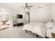Relaxing main bedroom suite boasts a walk-out balcony, soft carpet, and a neutral color scheme at 114 Batten Board Way, Woodstock, GA 30189