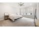Spacious main bedroom with large windows, neutral colors, and a walk-out balcony at 114 Batten Board Way, Woodstock, GA 30189