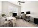 Bright home office with ample workspace, natural light from the window, and modern decor at 114 Batten Board Way, Woodstock, GA 30189