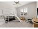 Bright room with unique loft bed, slide, play area, and natural light from the window at 114 Batten Board Way, Woodstock, GA 30189