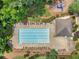 Community pool featuring lounge chairs and surrounding foliage at 1613 Brolington Ct, Conyers, GA 30013