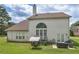 A backyard featuring a patio set and green lawn at 1613 Brolington Ct, Conyers, GA 30013