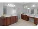 Bathroom featuring dual vanity sinks, tile flooring and a separate door to the water closet at 1613 Brolington Ct, Conyers, GA 30013