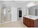 Bright and airy bathroom featuring walk in shower and expansive vanity at 1613 Brolington Ct, Conyers, GA 30013
