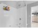 Bathtub and shower in a tiled bathroom with a showerhead and bathroom products at 1613 Brolington Ct, Conyers, GA 30013