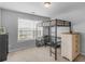 Bedroom featuring a modern loft bed with an integrated desk and storage shelves at 1613 Brolington Ct, Conyers, GA 30013