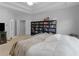 Bright primary bedroom with trey ceilings, full bookshelf and neutral color palette at 1613 Brolington Ct, Conyers, GA 30013