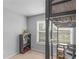 Neutral bedroom featuring a bunk bed, window with blinds, and shelving for ample storage at 1613 Brolington Ct, Conyers, GA 30013