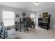 Bedroom with windows, a gaming computer setup, and an aquarium at 1613 Brolington Ct, Conyers, GA 30013
