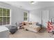 Cozy bedroom with lots of natural light, windows, and space to unwind at 1613 Brolington Ct, Conyers, GA 30013