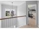 Hallway with chandelier, overlooking a bedroom with a bunkbed at 1613 Brolington Ct, Conyers, GA 30013