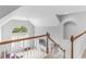 Second story hallway overlooking the living room with lots of natural light at 1613 Brolington Ct, Conyers, GA 30013