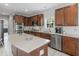 Well-equipped kitchen features stainless appliances, granite countertops, and ample cabinet space at 1613 Brolington Ct, Conyers, GA 30013