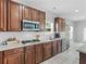 Updated kitchen featuring stainless steel appliances, white backsplash, and a gas cooktop on the counter at 1613 Brolington Ct, Conyers, GA 30013
