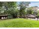 Spacious back yard featuring a well-maintained lawn and mature trees at 311 Glendale Ave, Decatur, GA 30030