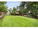 Landscaped backyard featuring a playground, treehouse, and shed at 311 Glendale Ave, Decatur, GA 30030