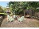 Backyard with a swing set and chairs creating a peaceful outdoor seating area at 311 Glendale Ave, Decatur, GA 30030