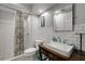 Well-lit bathroom with white subway tiles, a modern vanity, a shower, and a stylish curtain at 311 Glendale Ave, Decatur, GA 30030