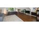 Open bedroom with hardwood floors, a large rug, a flat screen television and a couch at 311 Glendale Ave, Decatur, GA 30030