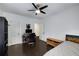 Cozy bedroom featuring hardwood floors, a comfortable bed, and a well-lit workspace at 311 Glendale Ave, Decatur, GA 30030