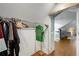 Walk-in closet featuring clothing racks with an open doorway to a sitting area at 311 Glendale Ave, Decatur, GA 30030