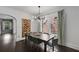 Dining room with dark wood table, modern chandelier, and large windows at 311 Glendale Ave, Decatur, GA 30030