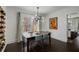 Bright dining area features a modern chandelier and views into the adjacent kitchen at 311 Glendale Ave, Decatur, GA 30030