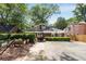 Brick home exterior with tidy landscaping, driveway, and garden beds at 311 Glendale Ave, Decatur, GA 30030