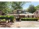Charming home exterior with landscaping, hardscape and long driveway on a sunny day at 311 Glendale Ave, Decatur, GA 30030