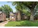 Beautiful brick home with stone details, mature trees, and a well-manicured front lawn at 311 Glendale Ave, Decatur, GA 30030