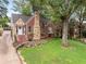 Charming brick home with stone accents, lush lawn, and inviting front entrance at 311 Glendale Ave, Decatur, GA 30030