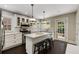 Charming kitchen with marble countertops, stainless steel appliances, and a cozy island with bar seating at 311 Glendale Ave, Decatur, GA 30030