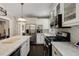 Well-equipped kitchen with stainless steel appliances, marble countertops, and custom white cabinetry at 311 Glendale Ave, Decatur, GA 30030