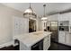 Eat-in kitchen boasts marble countertops, stainless steel appliances, and custom white cabinetry at 311 Glendale Ave, Decatur, GA 30030