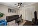 Comfortable living room with neutral paint, dark floors, stylish furniture and large closet at 311 Glendale Ave, Decatur, GA 30030